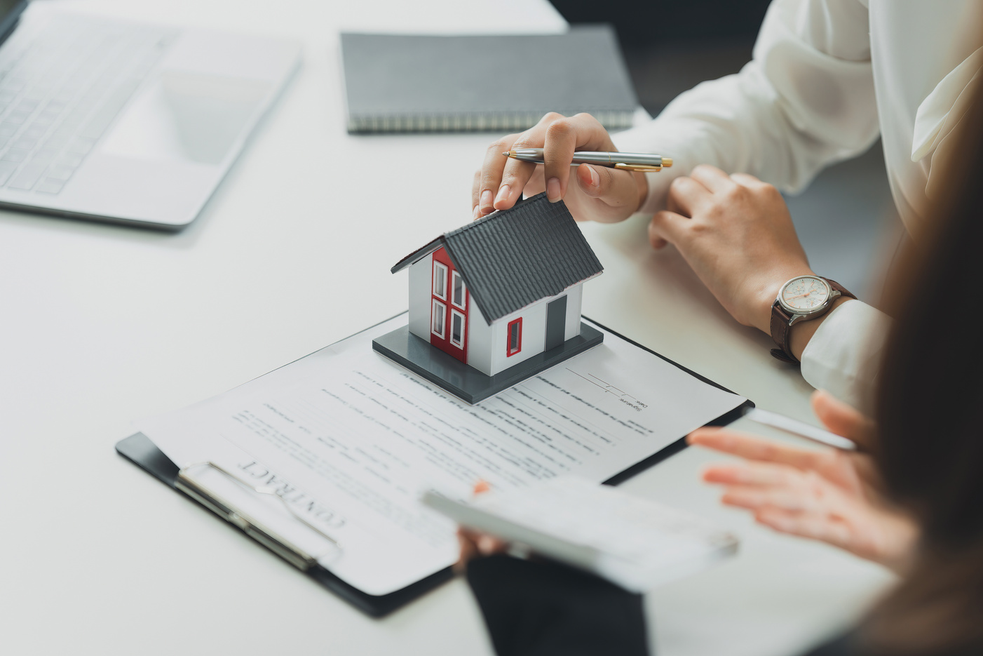 Banker or Agent calculate price for buy or loan house and sh